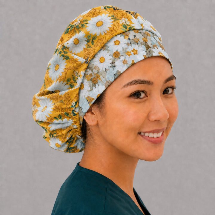 Monarch and daisy bouffant surgical cap for long hair, side view — golden floral print with deep gathered fit for OR and L&amp;D nurses
