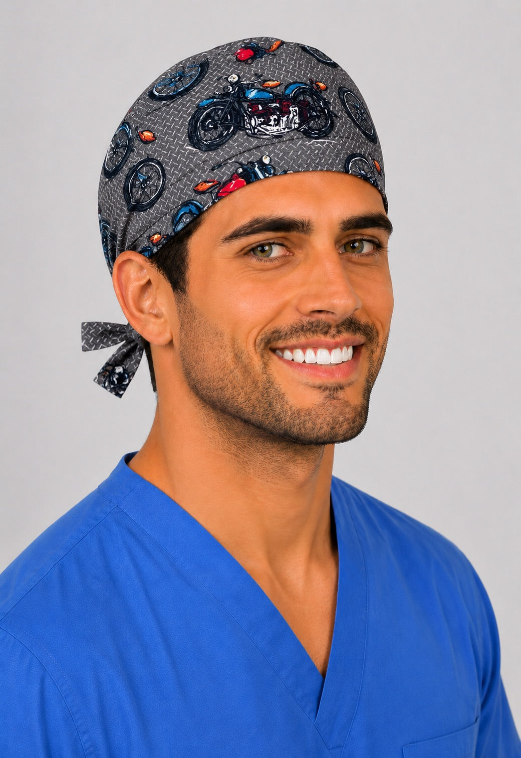 Motorcycle scrub cap front view on a man — classic bikes on grey tire-tread print, cotton tie-back surgical cap for nurses and OR techs