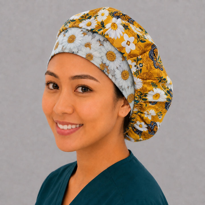 Mustard monarch bouffant cap for women, right angled smiling view — handmade daisy floral surgical cap, USA made