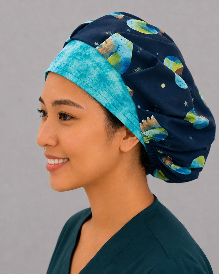 Navy globe bouffant cap for women, left side profile — eco-friendly earth print surgical cap handmade in the USA