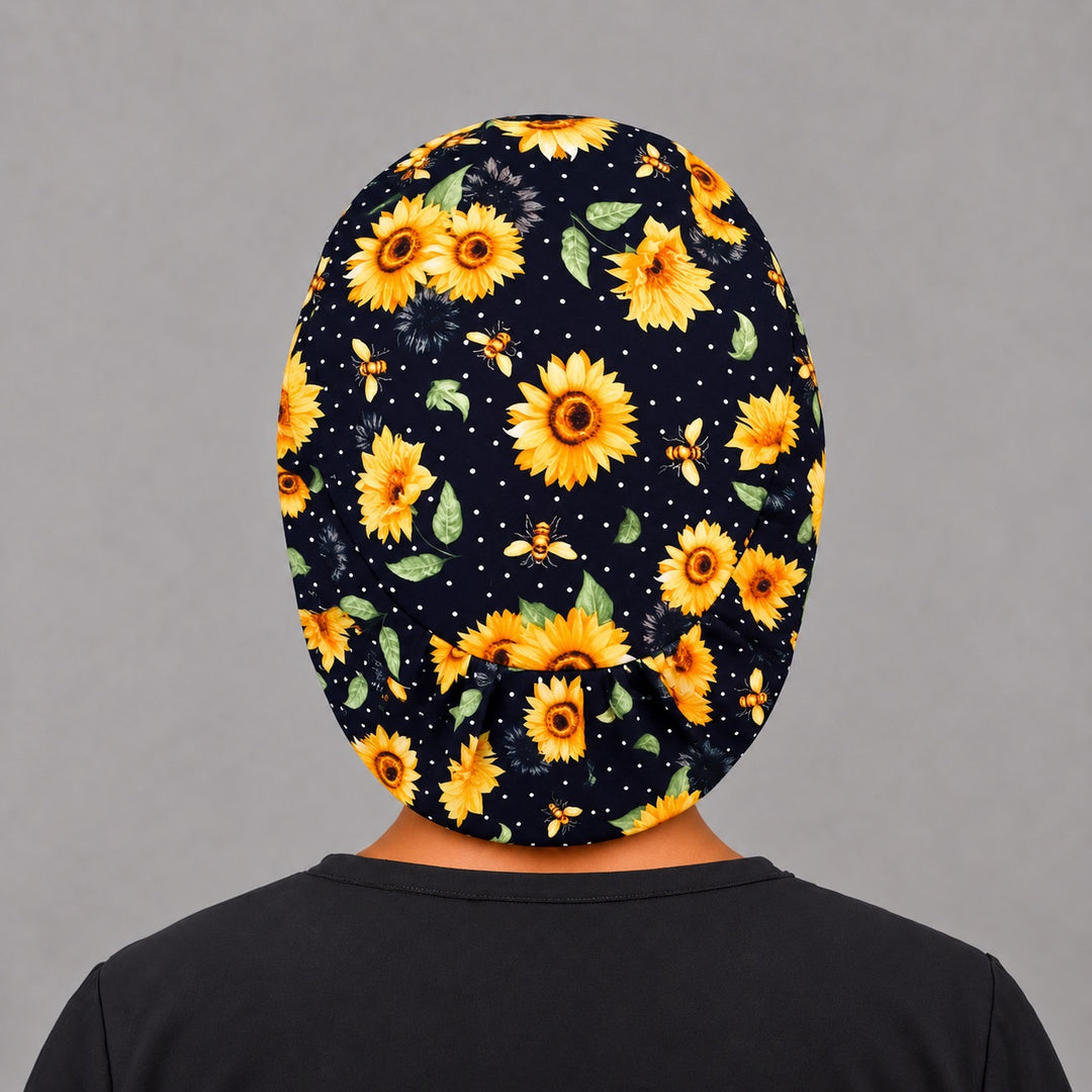 Navy sunflower Euro surgical cap, left angled view — elastic adjustable back that secures long or thick hair