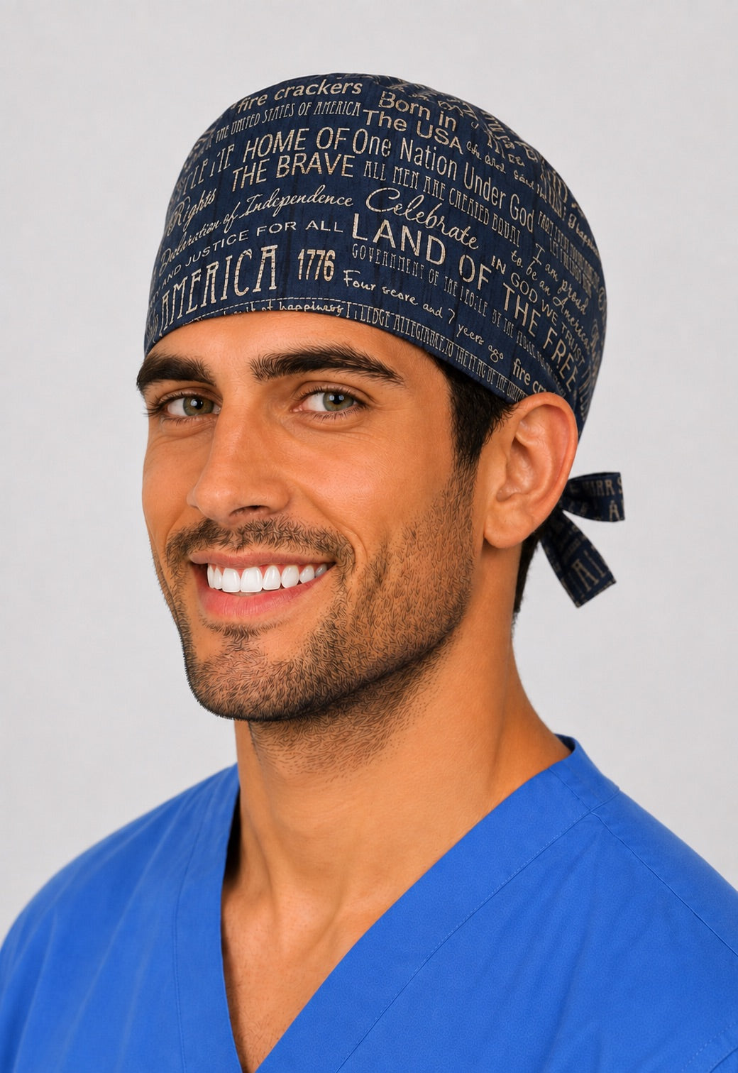 Right profile of navy USA patriotic word print unisex Fourth of July surgical hat for nurses and surgical techs