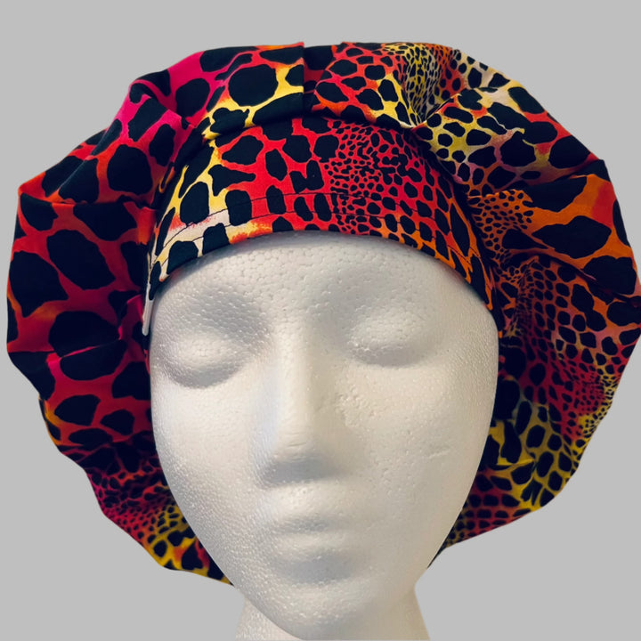 Side view of neon cheetah print bouffant scrub cap — handmade USA animal-print surgical hat for OR nurses with room for long hair.
