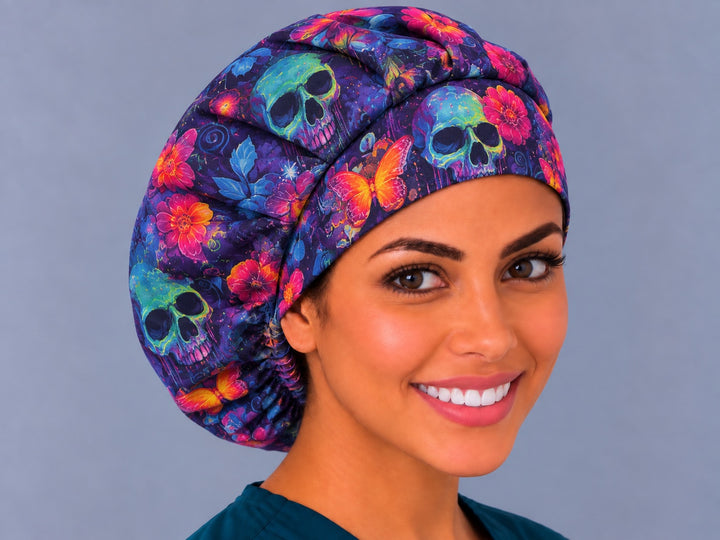 Neon floral skull bouffant scrub cap, left angled view — indigo and green skull print, handmade in the USA