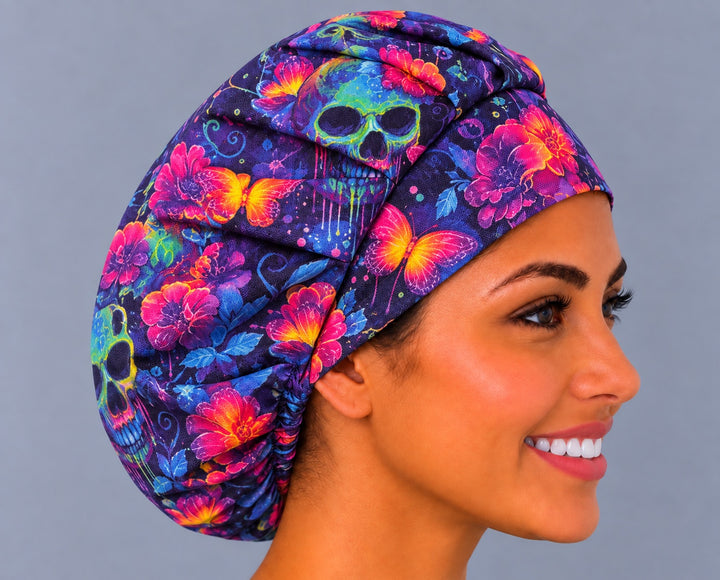 Right side profile of the Neon Skull bouffant cap — orange butterflies and gathered fit for thick or long hair