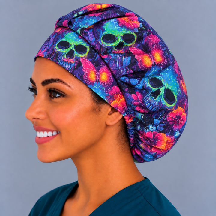 Back view of the Neon Skull &amp; Butterfly bouffant scrub cap — gathered crown showing glowing skulls, butterflies and flowers