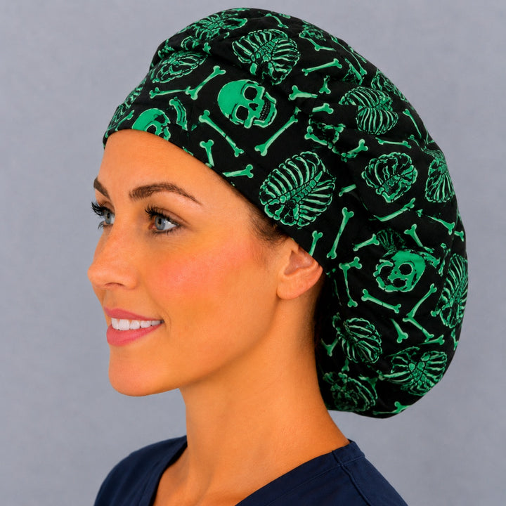 Neon skull and crossbones bouffant surgical cap, left side profile — gothic green print for OR nurses and surgical techs