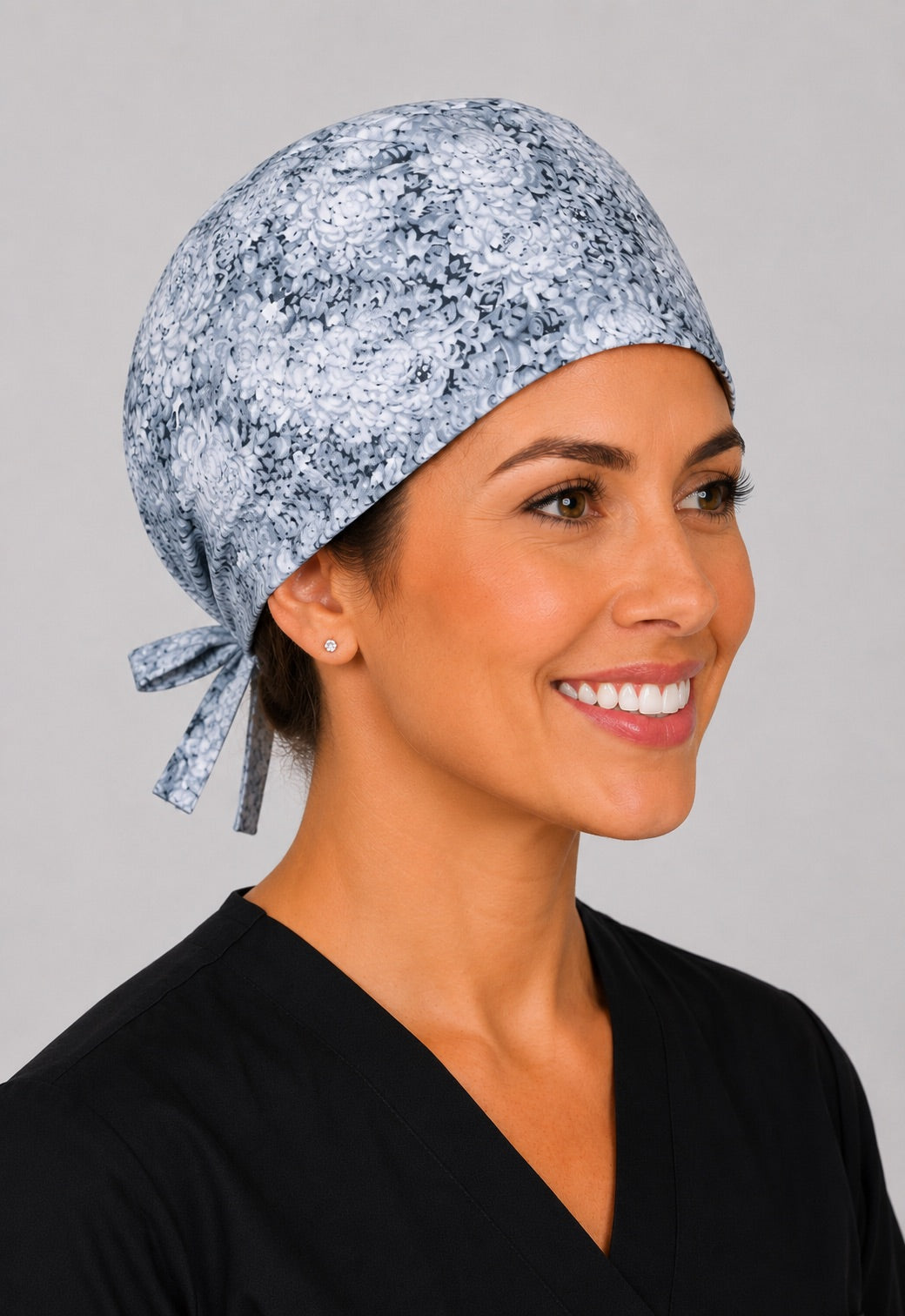 Left profile of neutral floral scrub cap for women with short hair, light gray OR cap