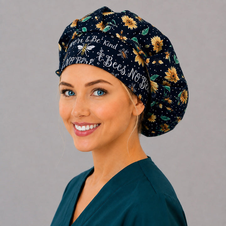 No Bees No Harm sunflower bouffant cap, angled smiling view — handmade black floral surgical cap, USA made