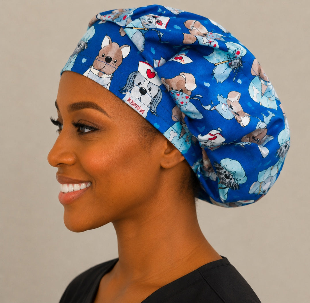 Nurse dog print bouffant scrub cap front view on smiling model showing puppies dressed as nurses and doctors on blue, women&