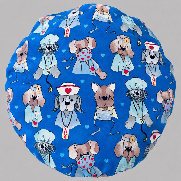 Nurse dog print bouffant scrub cap for women, front view, puppies dressed as nurses and doctors on blue, handmade surgical hat by OR World