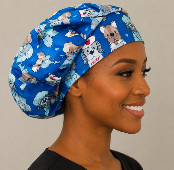 Nurse dog print bouffant scrub cap left side profile showing puppies dressed as nurses and surgeons on blue, women&