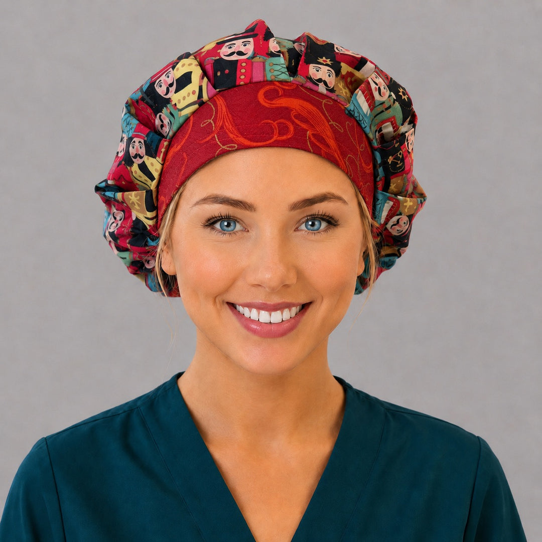 Woman wearing a Christmas nutcracker bouffant scrub cap, front view — colorful toy soldiers with a crimson gold swirl band, adjustable women&