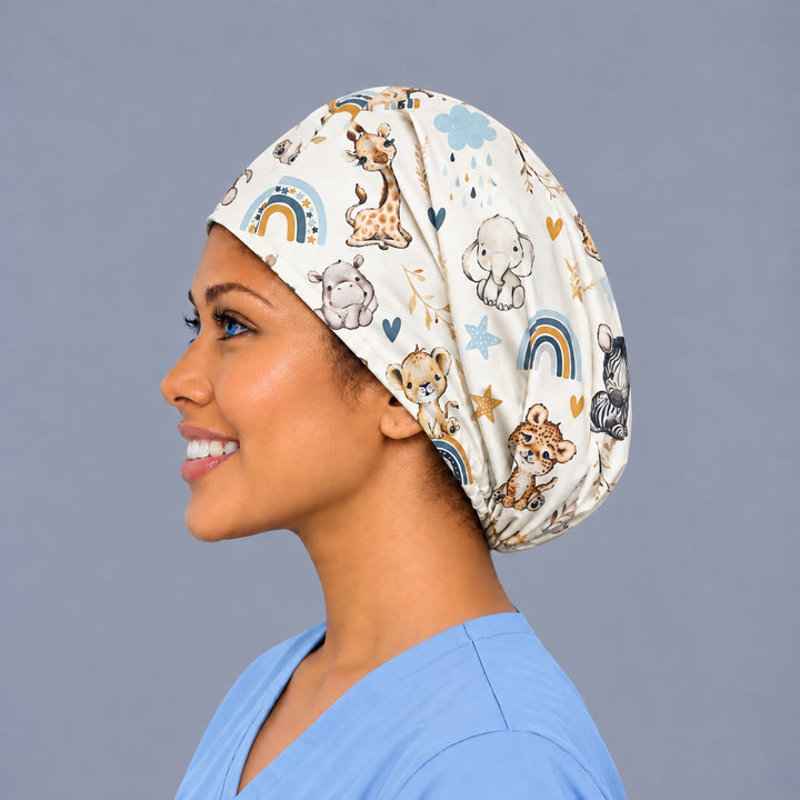Left side profile of an OB nurse euro cap in 100% cotton, showing the deep crown with room for long hair and a baby zebra and cheetah at the back