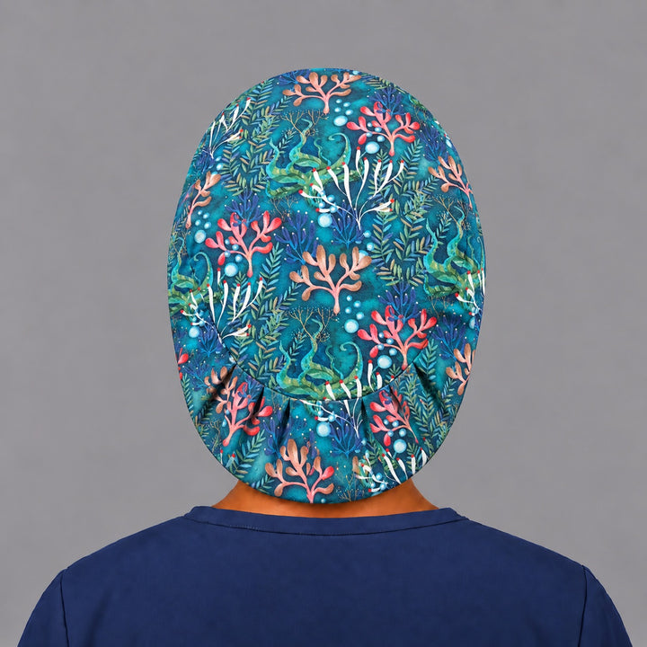 Back view of the ocean coral Euro scrub cap — elastic gathered back showing the full underwater reef print