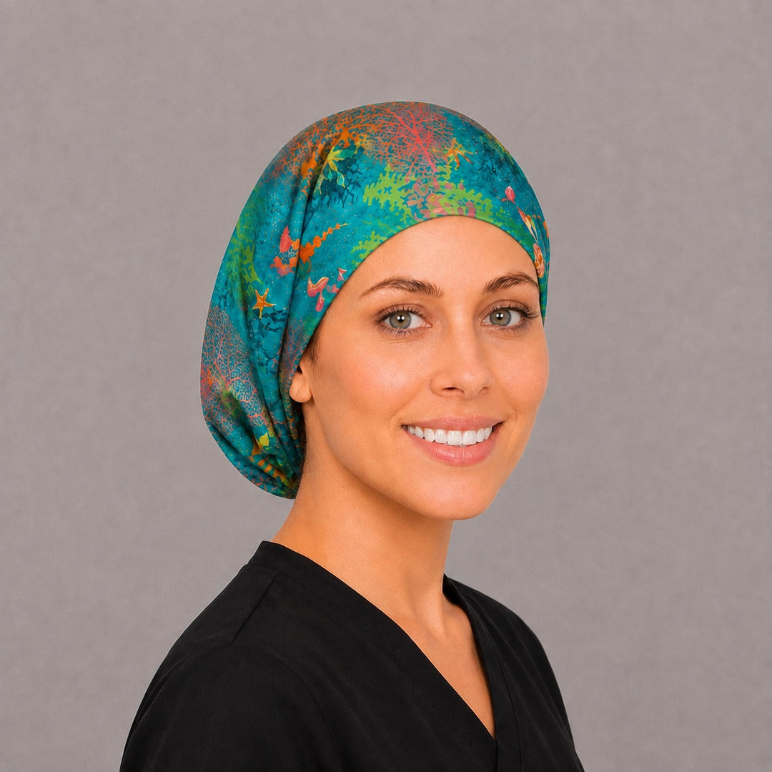 Back view of the ocean reef Euro scrub cap — full coverage showing coral fans, kelp and seahorses across the teal crown