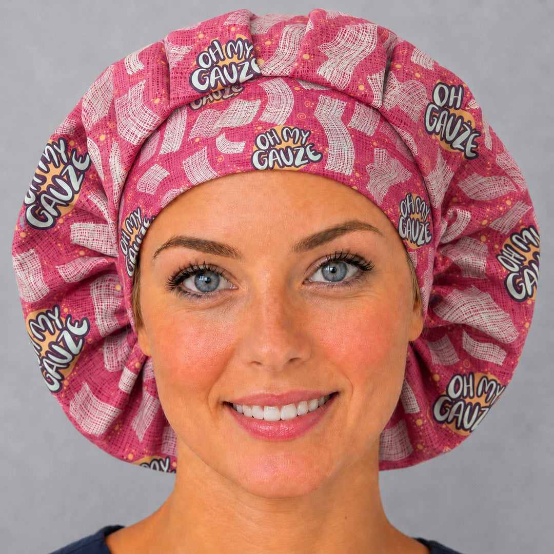 Woman wearing an Oh My Gauze bouffant scrub cap, front view — funny gauze print on raspberry pink, adjustable women&