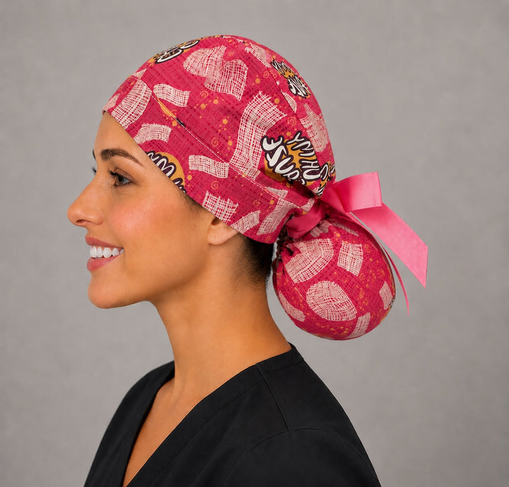 Oh My Gauze ponytail scrub cap right side profile with gathered pouch of pink gauze print and long hot pink ribbon ties