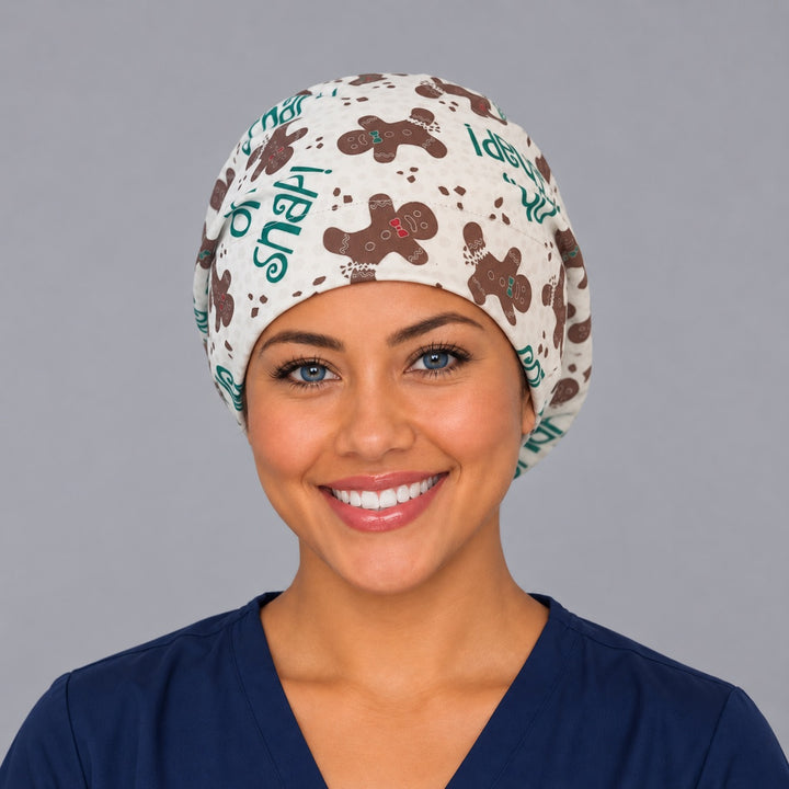 Woman wearing an Oh Snap gingerbread Euro scrub cap, front view — funny gingerbread men on cream, adjustable Christmas surgical hat