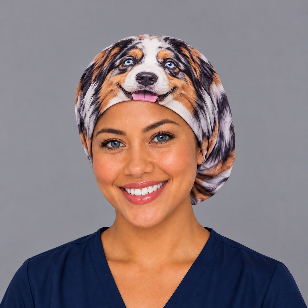Front view of a unique pet face euro surgical hat with blue eyes and smiling dog face centered on the band, bespoke gift for surgeons and OR nurses
