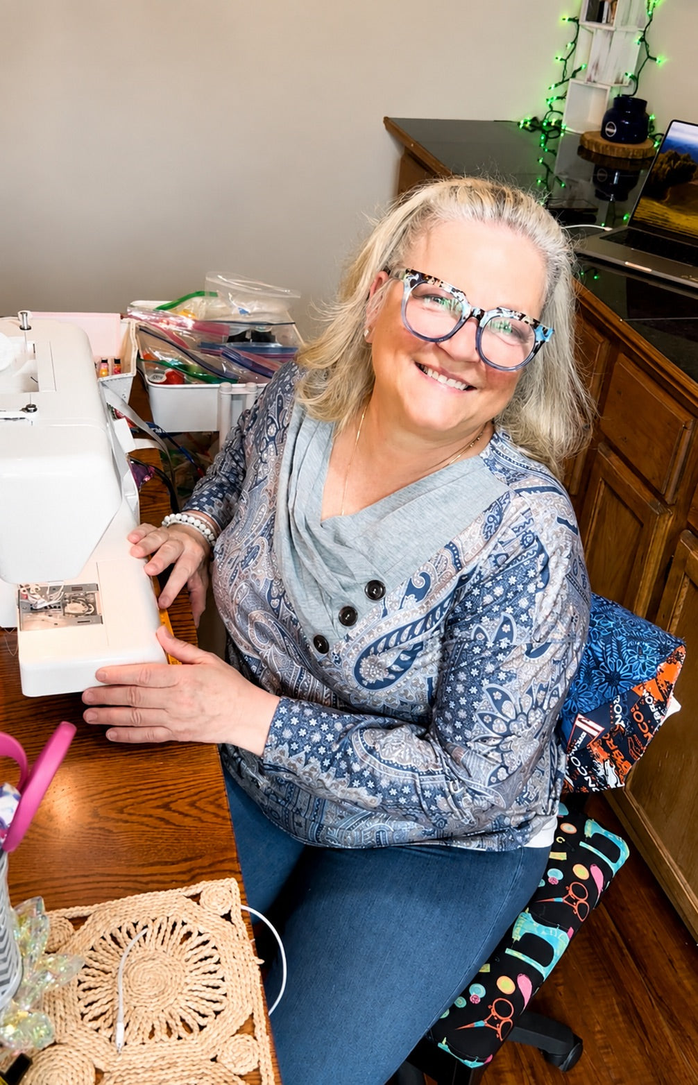 OR World co-founder handmaking a custom scrub cap at her sewing machine — women-owned, handmade in the USA