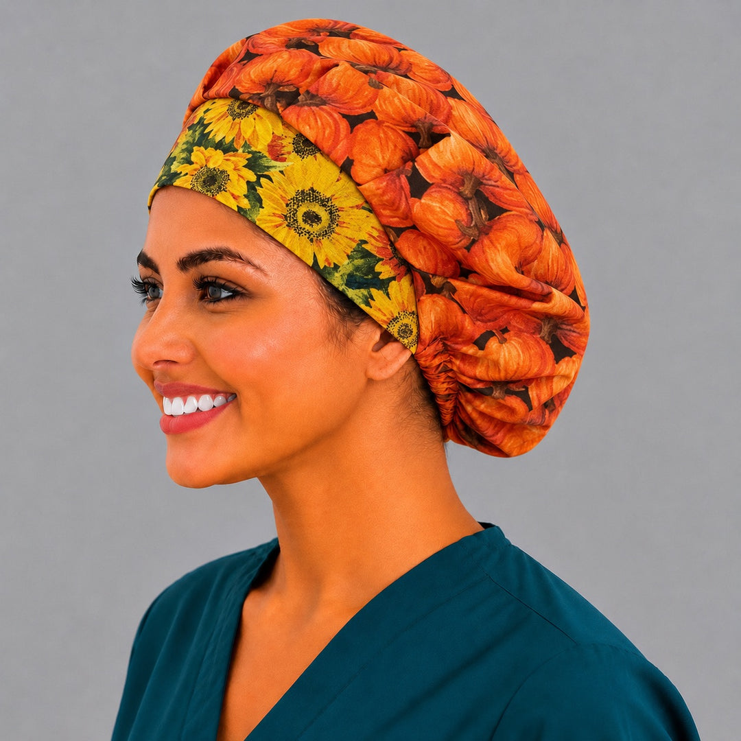 Orange pumpkin and sunflower bouffant scrub cap, left side profile — roomy elastic-back cap that secures long thick hair for OR nurses