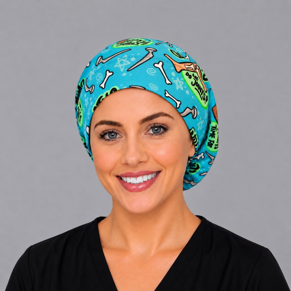 Back view of the ortho bone Euro scrub cap — elastic gathered back showing bones and joint jokes across the turquoise crown
