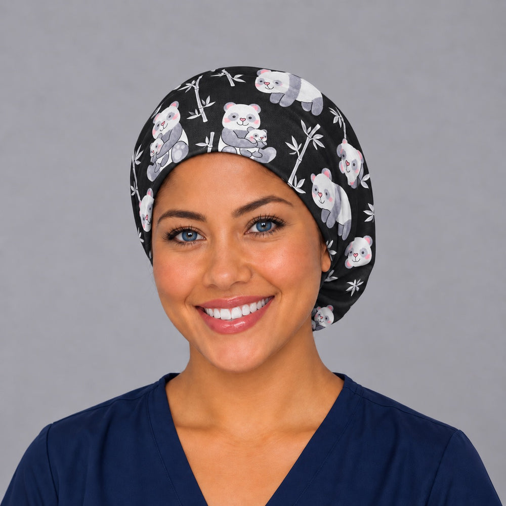 Woman wearing a cute panda Euro scrub cap, front view — watercolor pandas and bamboo on black, adjustable surgical hat for nurses