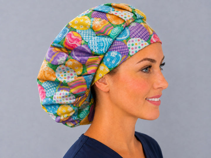 Right side profile of the pastel Easter egg bouffant surgical hat — turquoise, purple and pink eggs, roomy breathable cotton cap for nurses
