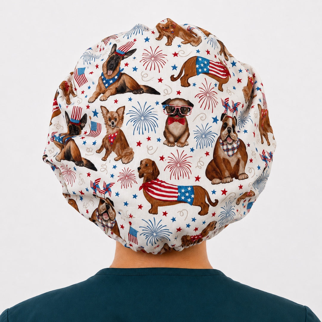 Back view of the patriotic dog bouffant scrub cap — full gathered fit showing dachshunds, bulldogs and shepherds in flag bandanas on cream