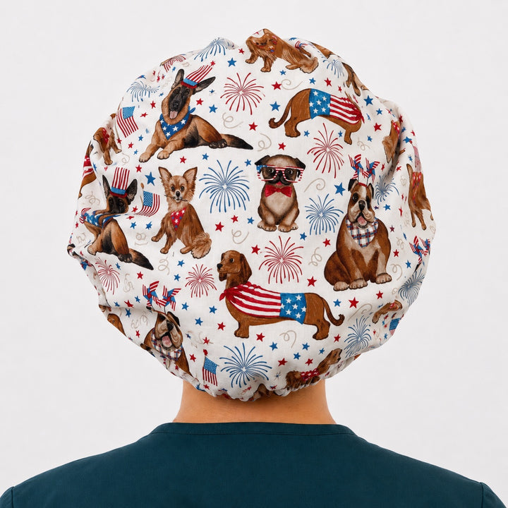 Back view of the patriotic dog bouffant scrub cap — full gathered fit showing dachshunds, bulldogs and shepherds in flag bandanas on cream