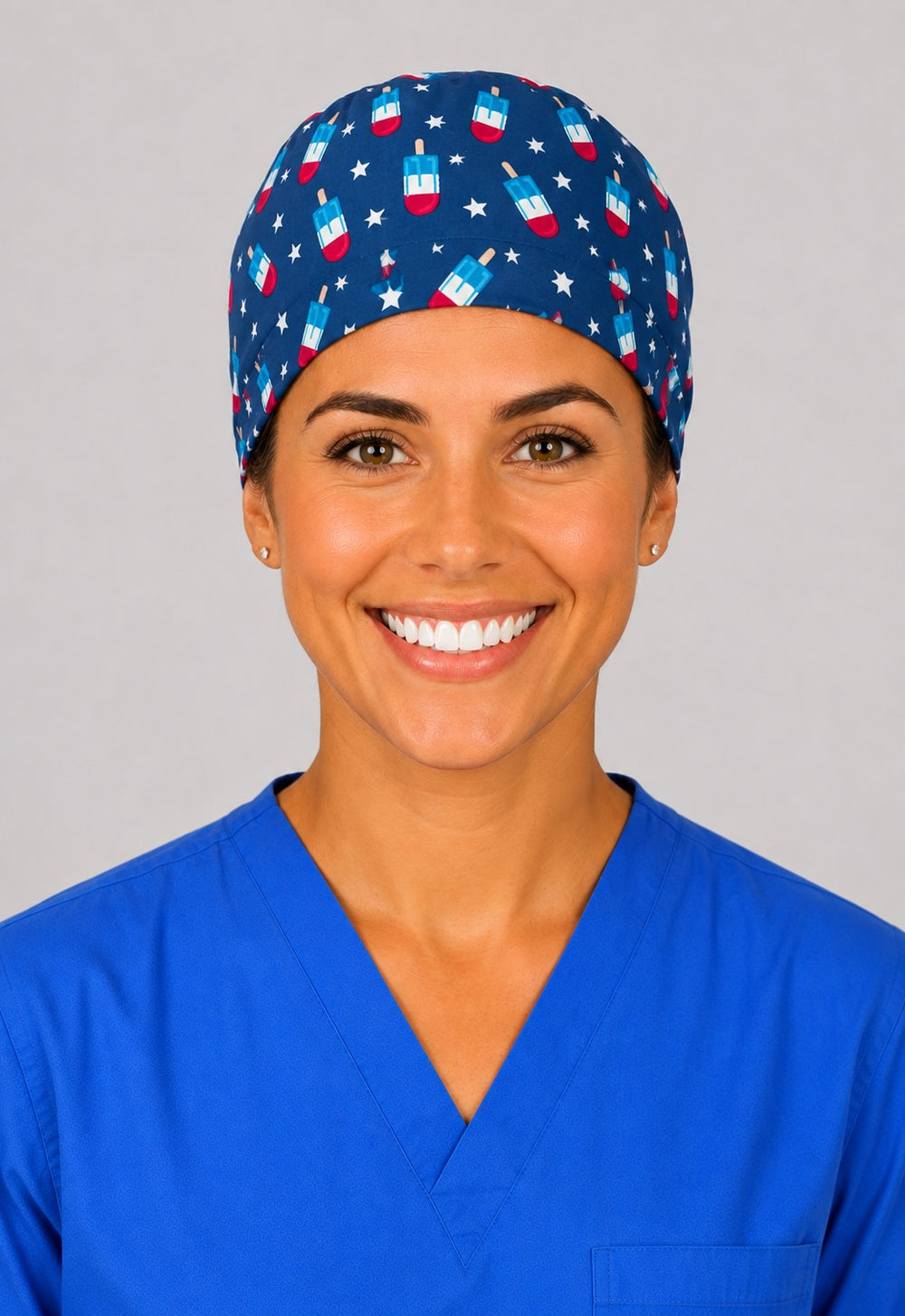 Patriotic popsicle scrub cap for short hair, handmade navy tie-back surgical hat with red white and blue popsicles on OR nurse, front view