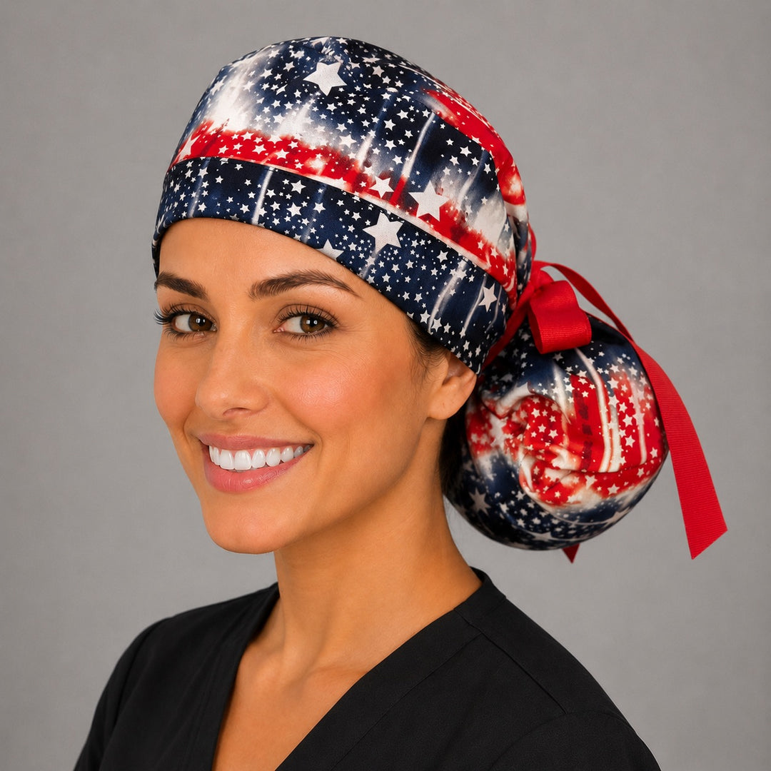 Patriotic tie-dye ponytail scrub cap on model showing ponytail pouch and red ribbon ties, long hair nurse hat, OR World
