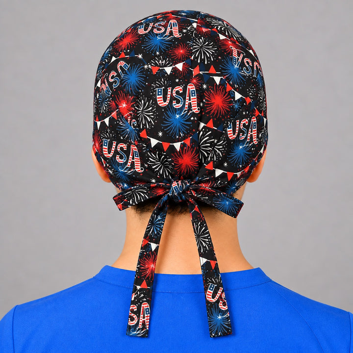 Rear knot on patriotic USA scrub hat with black fabric ties, unisex fit shown on a man from behind