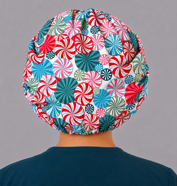 Back view of the peppermint candy bouffant scrub cap — elastic gathered back showing red, teal, pink and green swirls