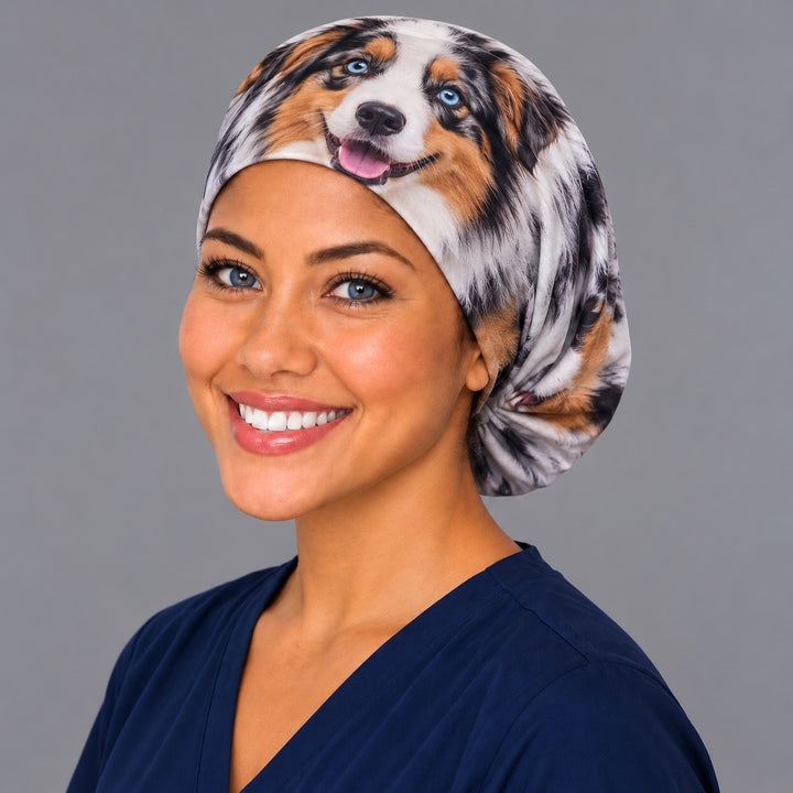Nurse wearing a personalized pet face euro scrub cap with a lifelike blue merle Australian shepherd portrait wrapped around the cap, one of a kind custom surgical hat handmade in the USA by OR World