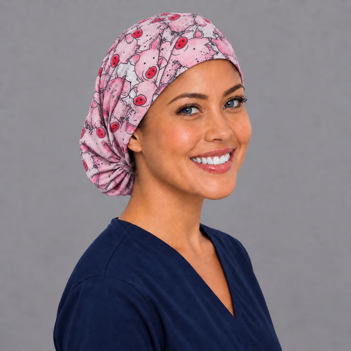 Pig print Euro scrub cap, right angled smiling view — farm animal print favorite with veterinary teams