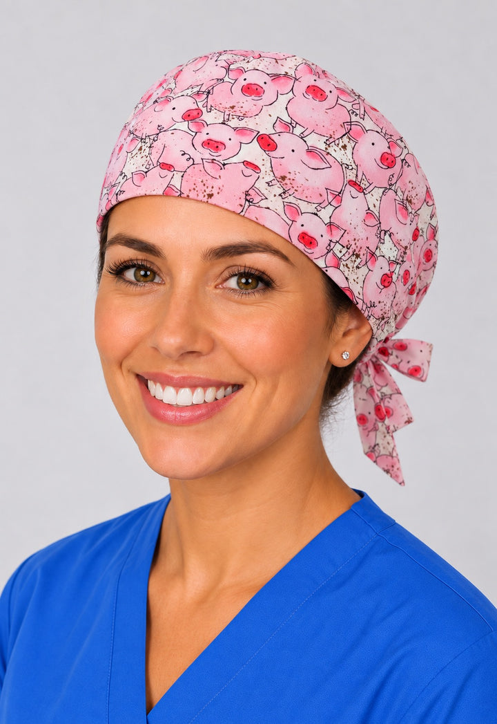 Pink pig farm animal scrub cap for short hair, handmade tie-back surgical hat on smiling OR nurse, three-quarter view