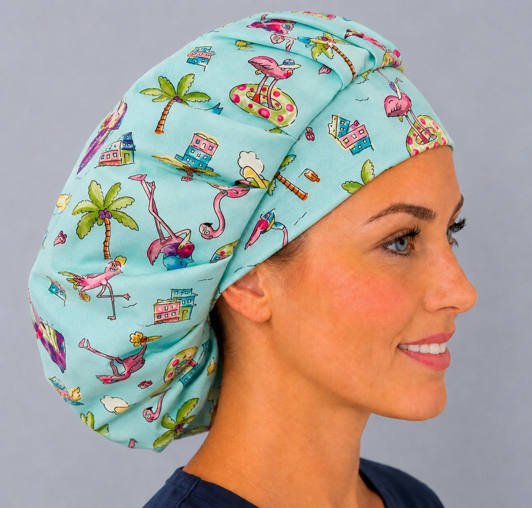 Side view of the pink flamingo beach bouffant surgical cap — palm trees, beach houses and flamingos on aqua, breathable cotton cap for nurses