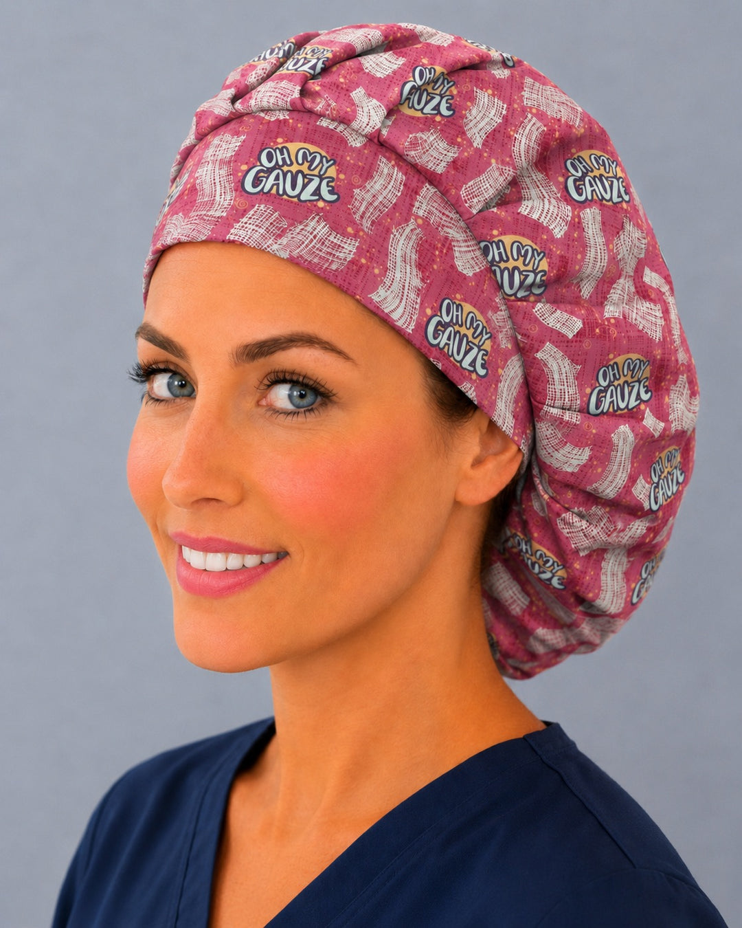 Pink Oh My Gauze bouffant cap for women, left angled smiling view — handmade funny nurse surgical cap, USA made