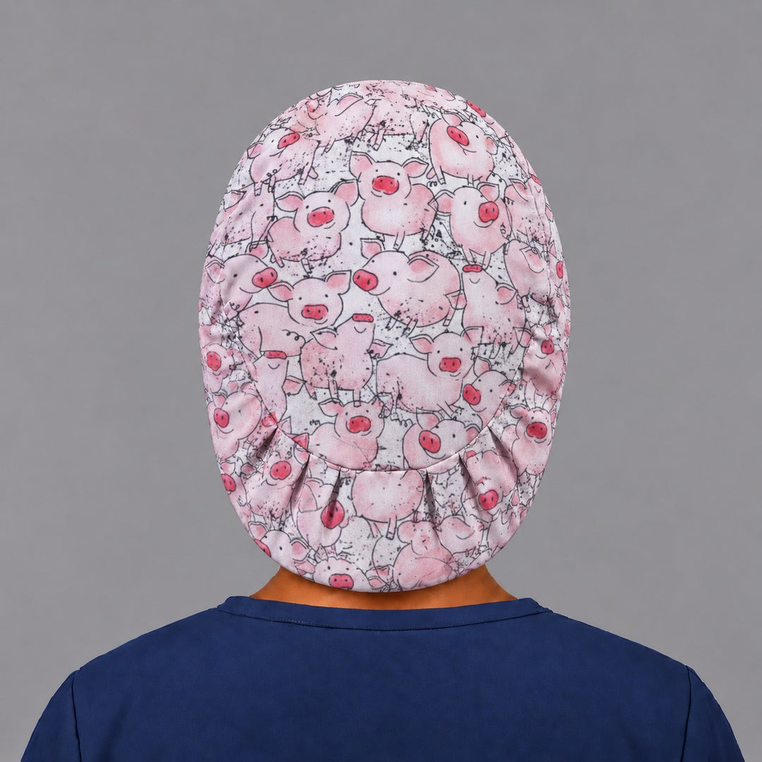 Back view of the pink pig Euro scrub cap — elastic gathered back showing pigs across the crown