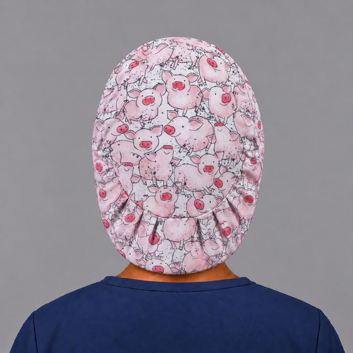 Back view of the pink pig Euro scrub cap — elastic gathered back showing pigs across the crown