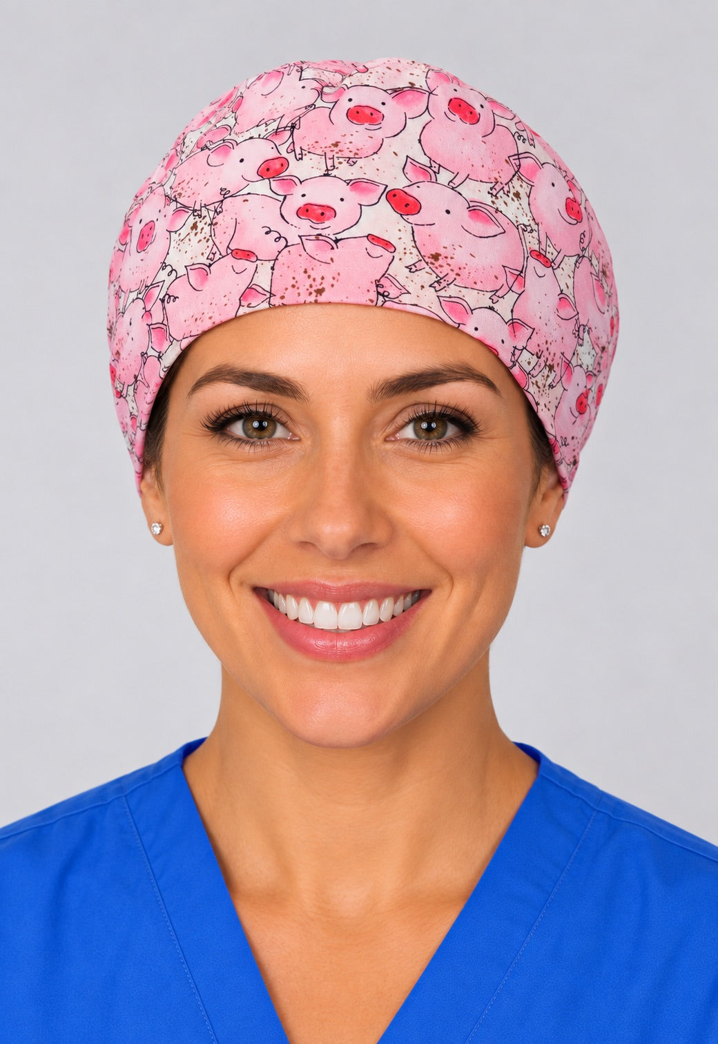 Front view of pink pig print unisex adjustable surgical hat for veterinarians and surgical techs
