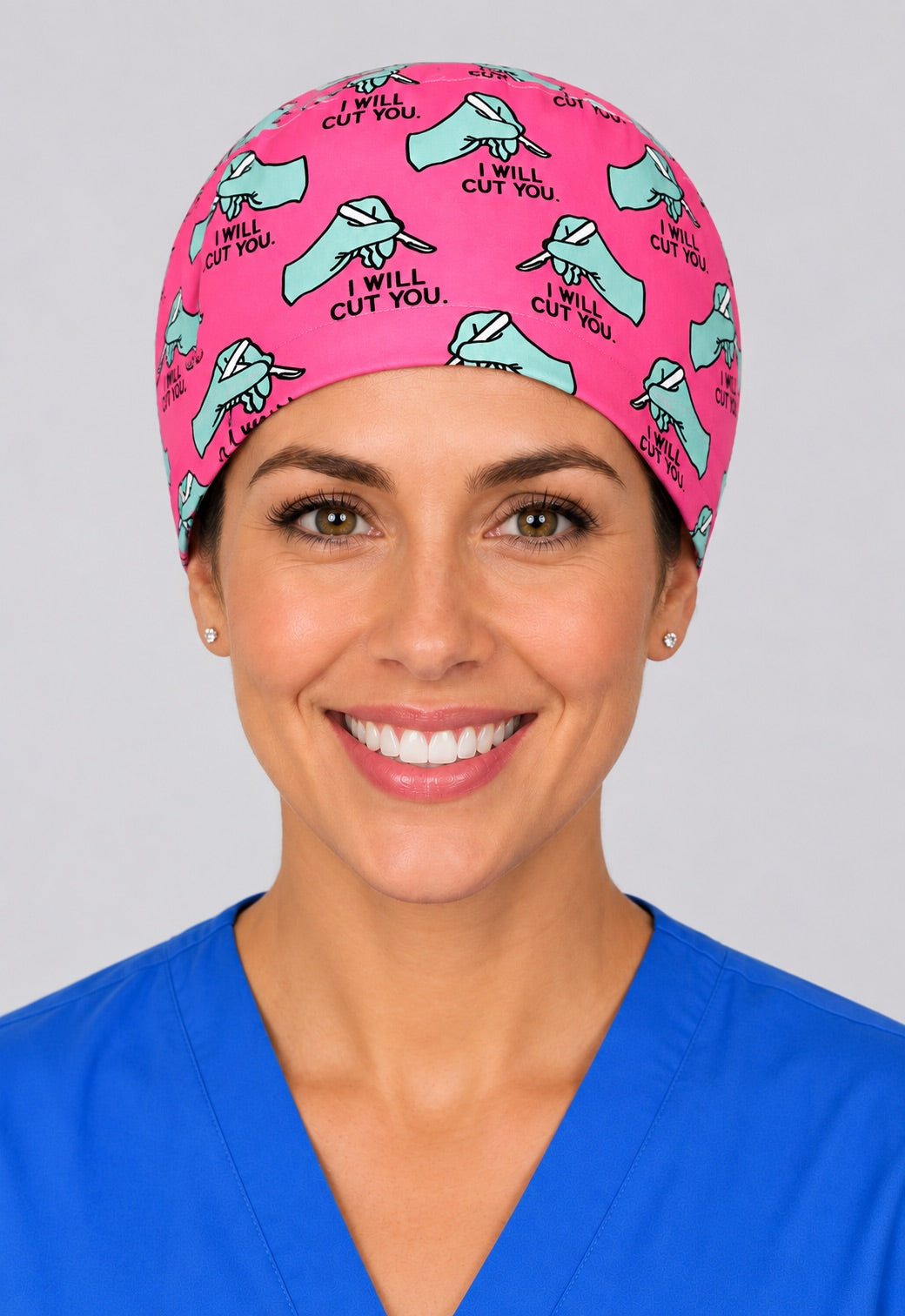 Pink surgical humor tie back cap front view, short hair scrub hat for nurses, midwives and surgical techs