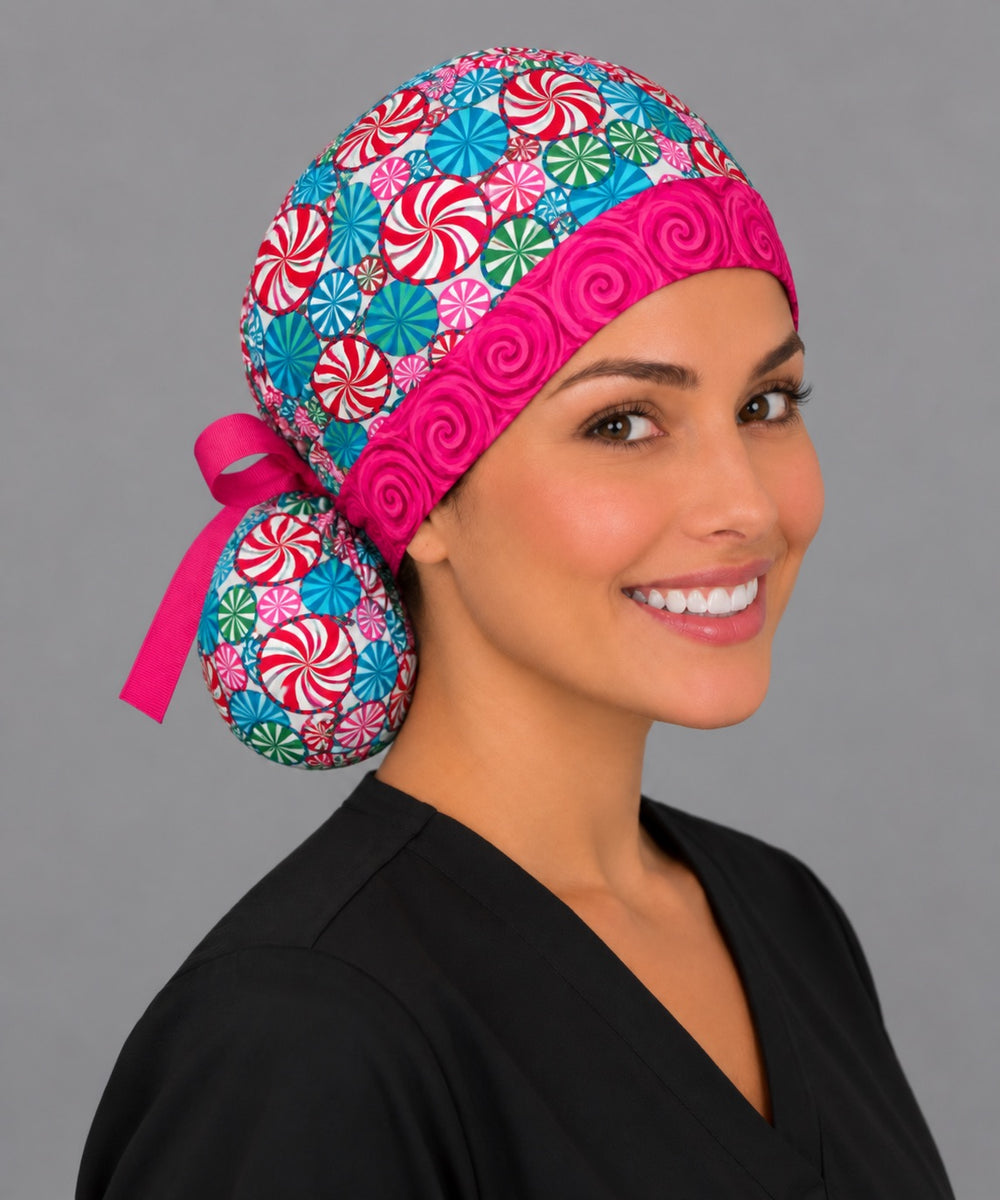 Pink swirl band ponytail surgical hat, right angled smiling view — deep pouch that holds long or thick hair