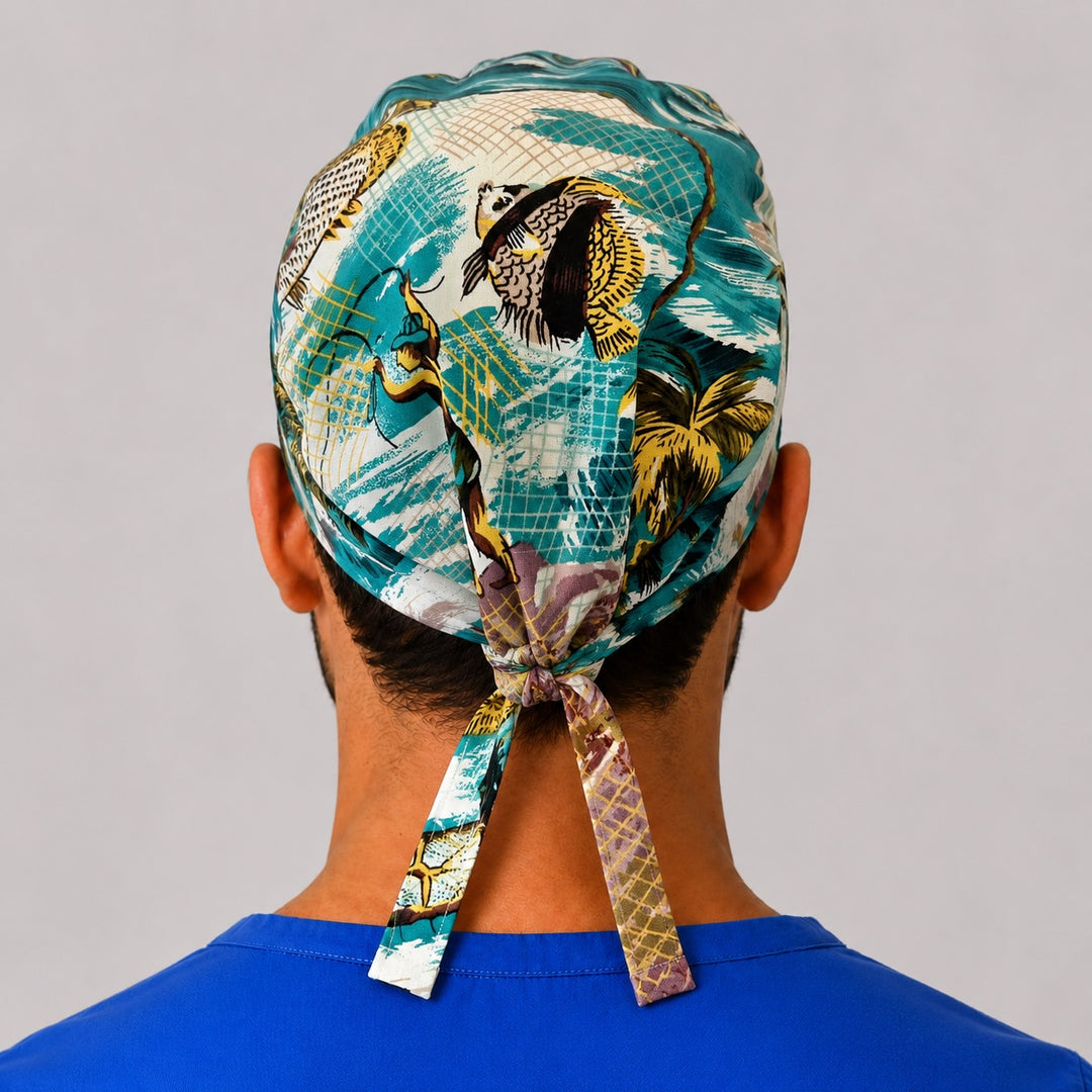Back view of the Polynesian fishing tie-back scrub cap showing the bow tie closure and full tropical fisherman print