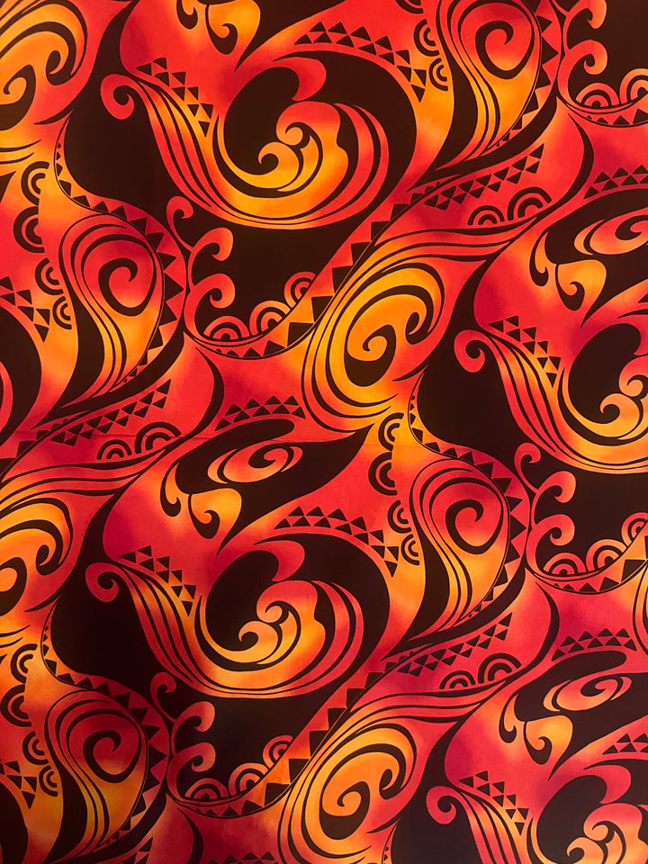 Close-up of the 100% premium cotton fabric swatch used for the Polynesian tribal scrub cap for men, red and orange tribal tattoo print detail