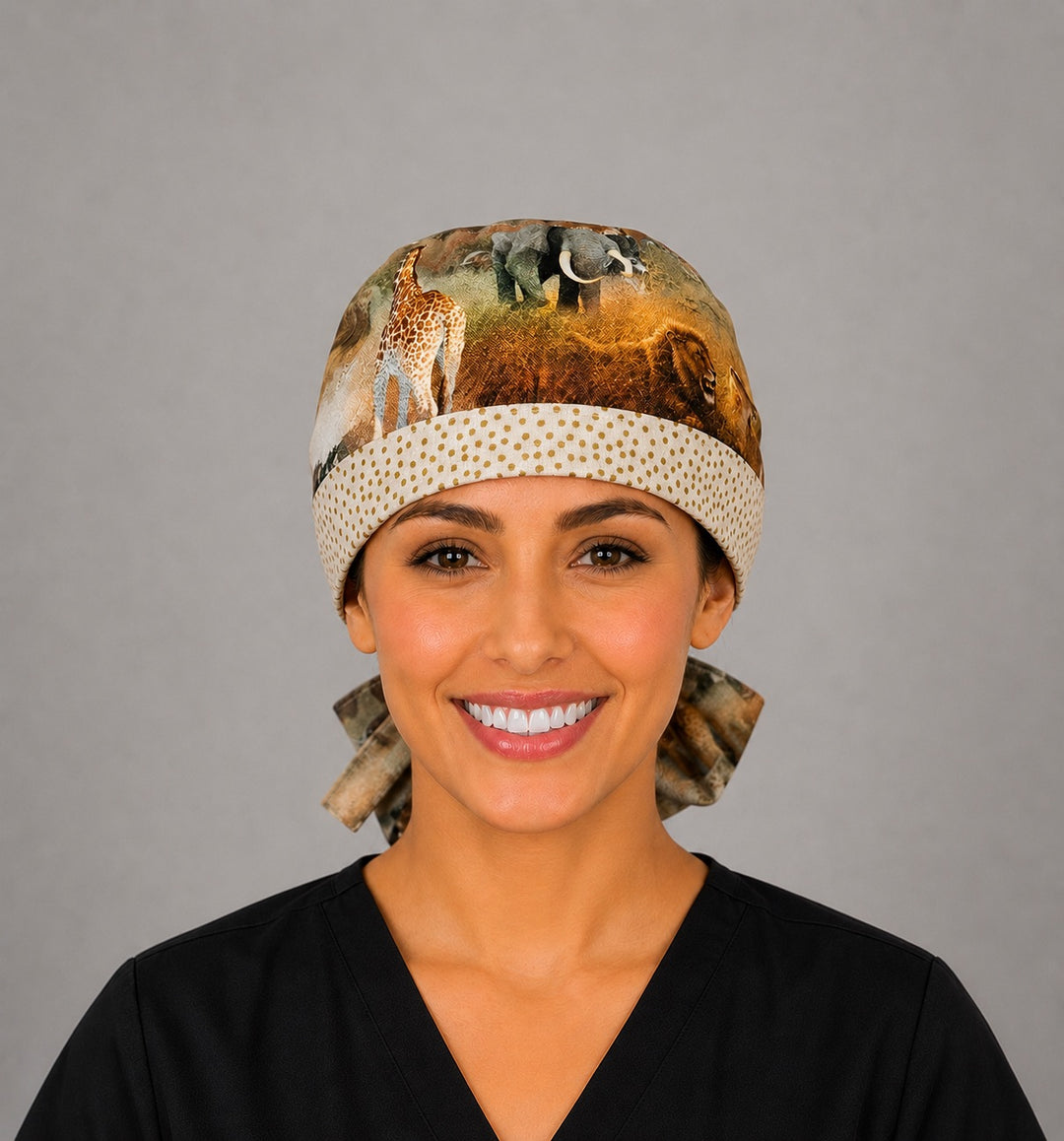 Front view of African safari animal print ponytail scrub cap for women with elephant, giraffe and lion print and dotted band