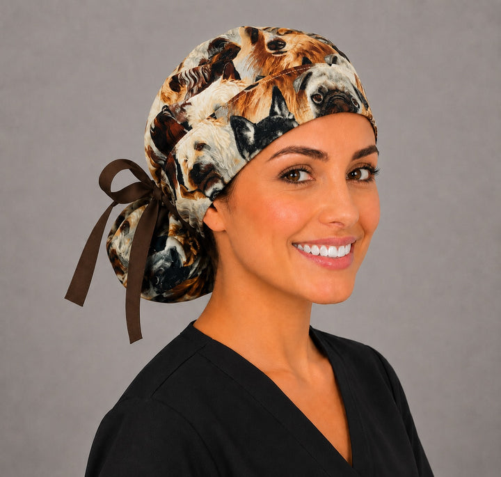 Dog lover ponytail nurse cap front view on smiling model showing pugs, retrievers and terriers print with brown trim