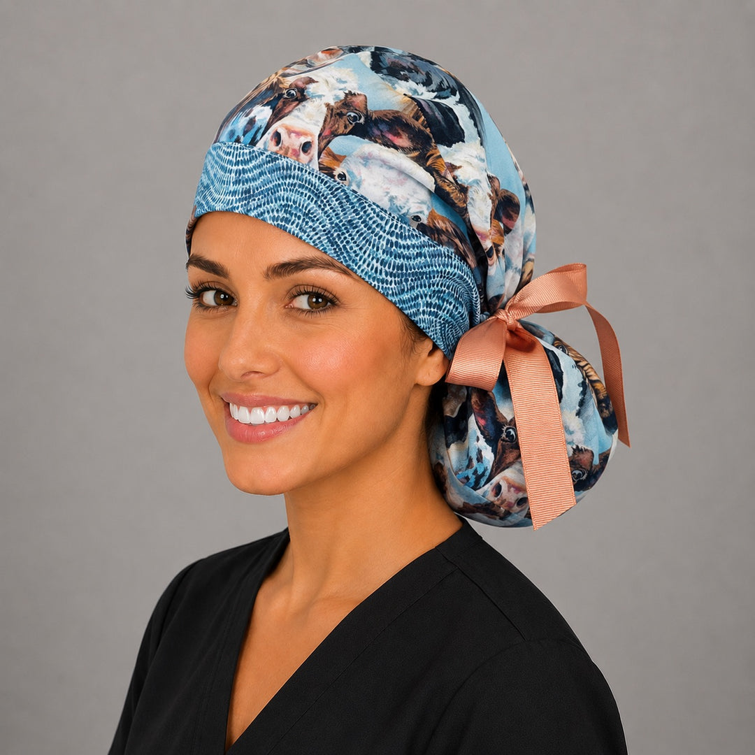 Woman wearing Highland cow ponytail scrub cap, right angle view with full ponytail pouch and peach bow